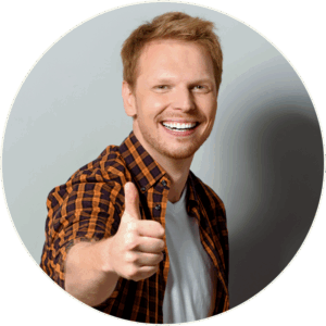 Smiling person in plaid shirt giving a thumbs-up, representing patient relief and positive response to SPRAVATO® Therapy for treatment-resistant depression and severe depressive symptoms.