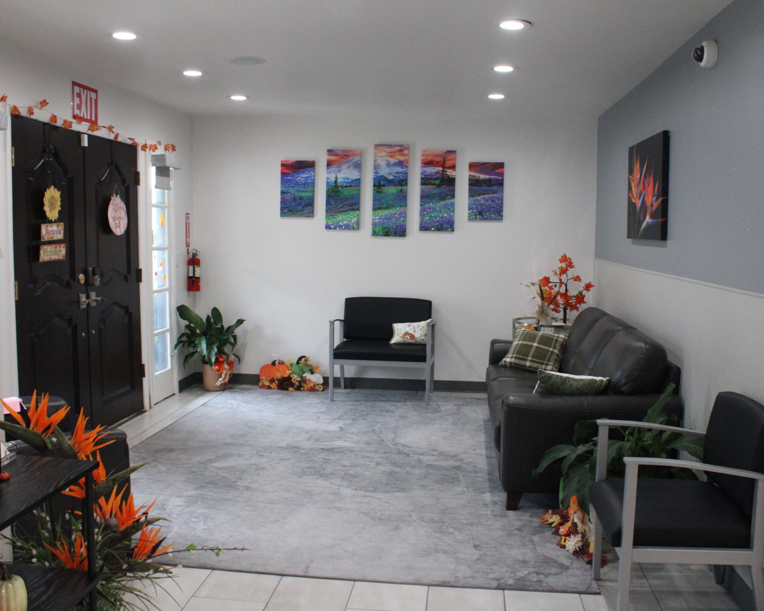 Inviting lobby at Mind Rejuvenation, Tulsa’s leading mental wellness clinic—featuring plush leather seating, soft natural light, calming artwork, and serene décor that welcomes guests into a space of comfort, care, and elevated therapeutic experience.